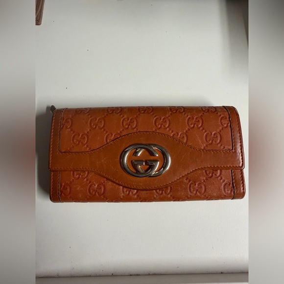 Gucci Handbags - Gucci Brown Embossed Leather Wallet
